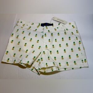Blue Rain pineapple print shorts with scalloped pockets, sold by Francesca’s XS